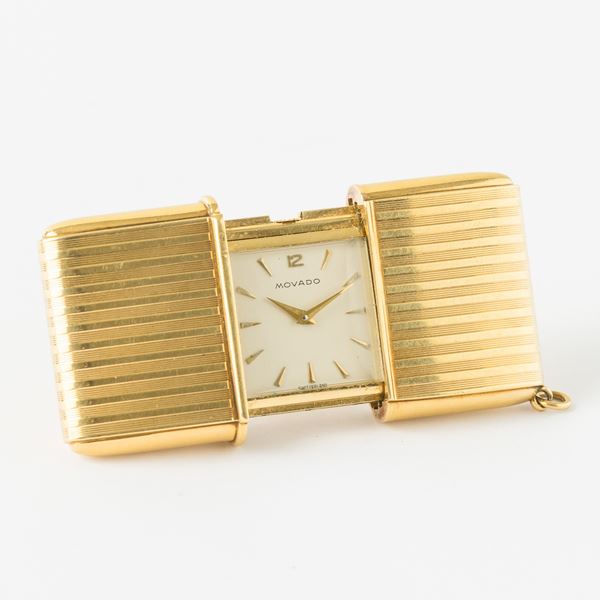 Movado ermeto, orologio da viaggio, 1950 circa, carica manuale, in oro 18 kt, gr 64, 45x25 mm