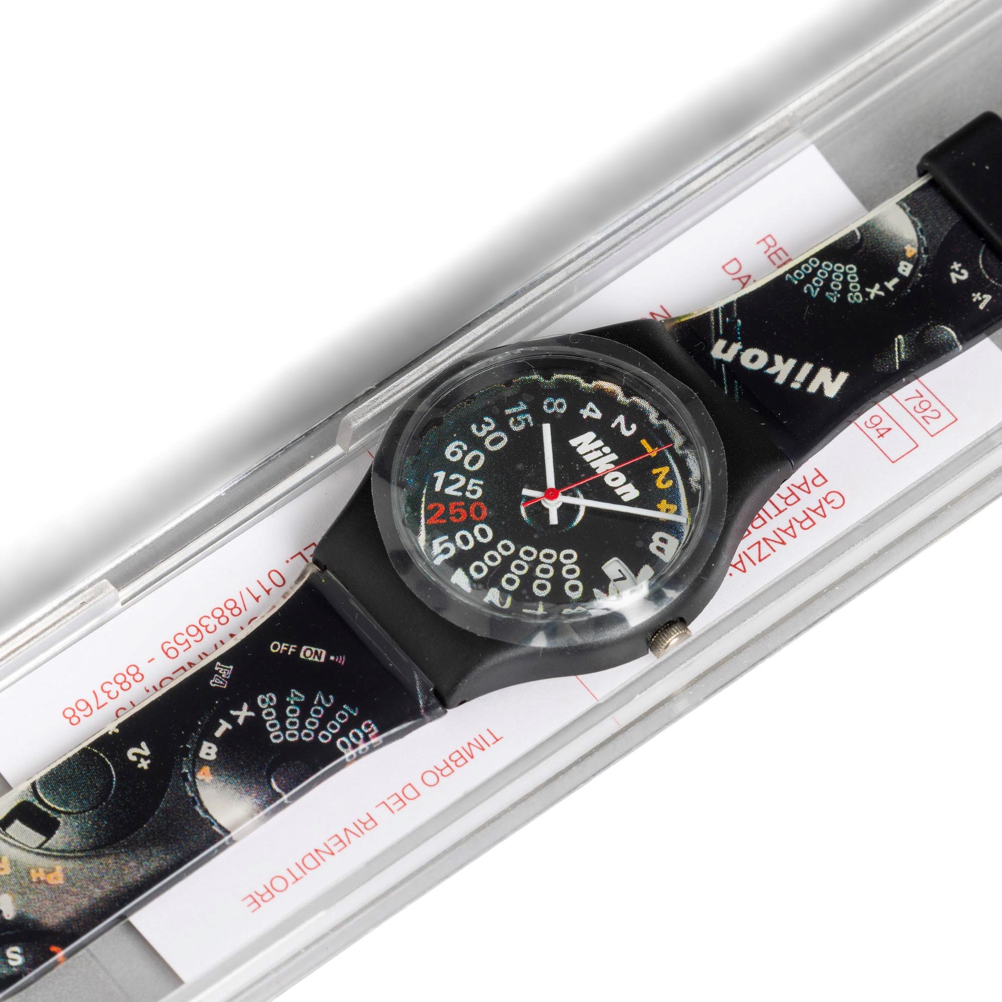 Nikon - Orologio in plastica con quadrante nero, indicazione tempi di esposizione e datario al tr...