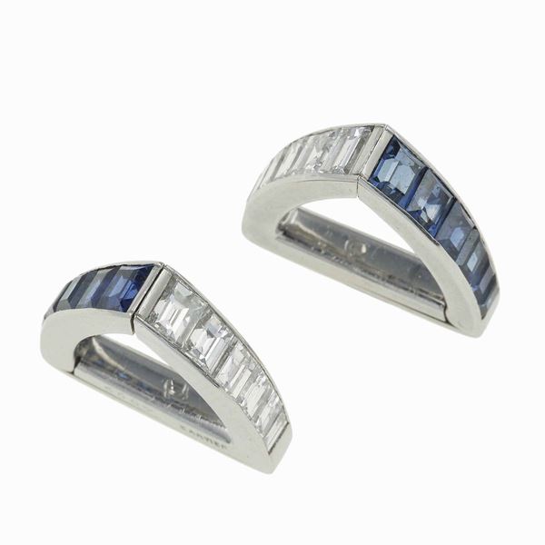 Pair of diamond, sapphire and platinum cufflinks. Signed and numbered Cartier, 4099