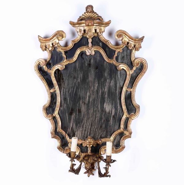 Coppia di specchiere a due luci in legno intagliato e dorato. XVIII-XIX secolo