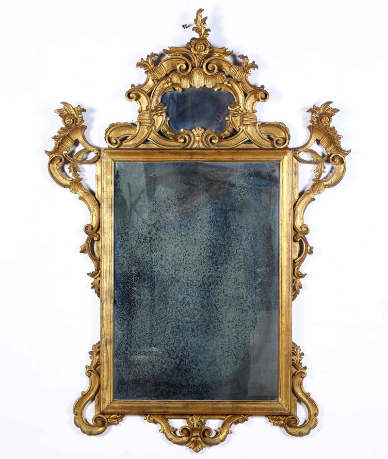 Specchiera in legno intagliato e dorato. XIX secolo  - Asta Antiquariato febbraio - Cambi Casa d'Aste