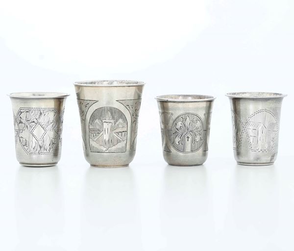Quattro bicchieri. Argento fuso, sbalzato e cesellato. Russia fine XIX secolo, differenti manifatture