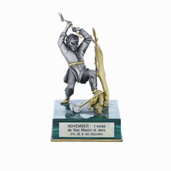 Taglialegna. Argento e argento dorato. Base in malachite. Argenteria artistica italiana del XX-XXI secolo