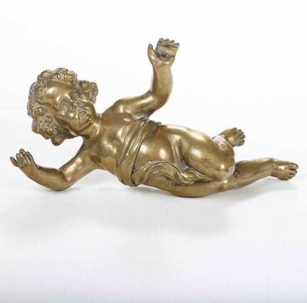 Putto in bronzo dorato. Arte barocca del XVII-XVIII secolo