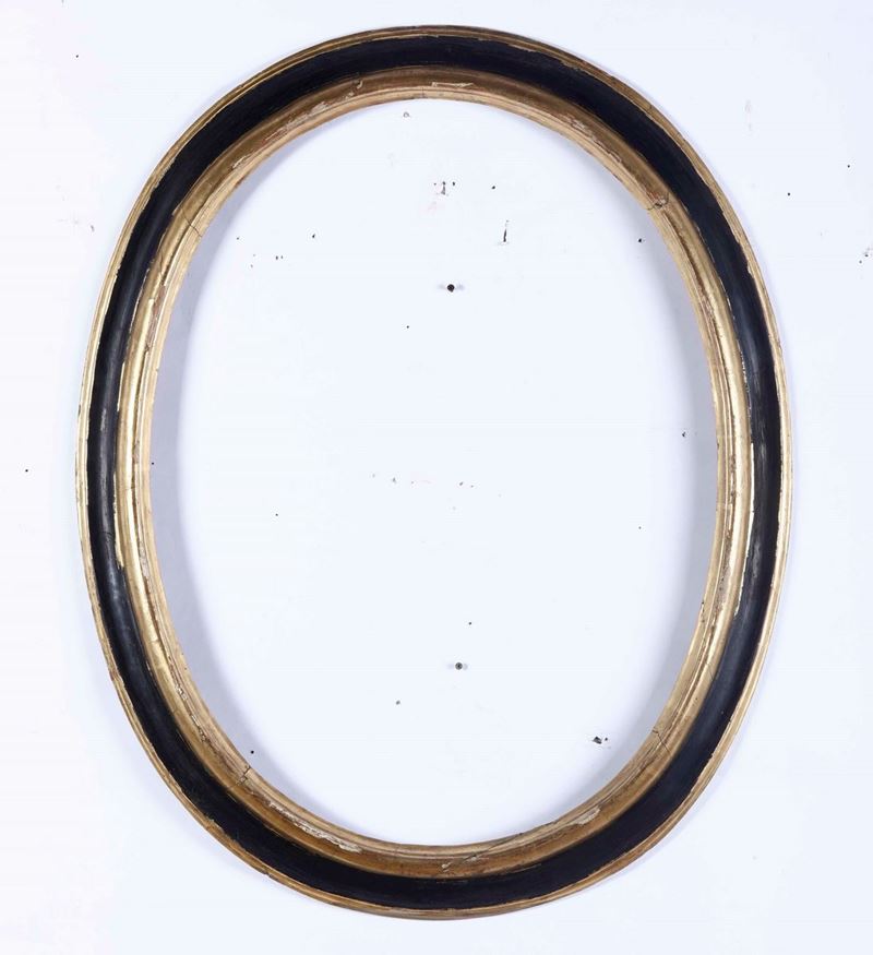 Cornice ovale in legno ebanizzato con profili dorati  - Auction Antique January - Cambi Casa d'Aste