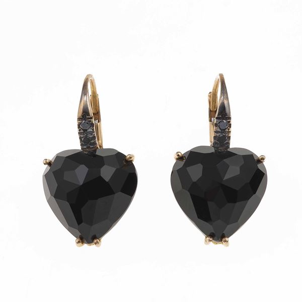 Pair of onix and diamond earrings