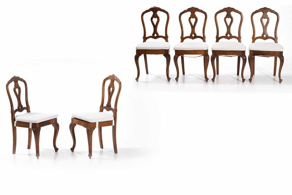 Sei sedie in legno intagliato con schienale traforato. XIX secolo