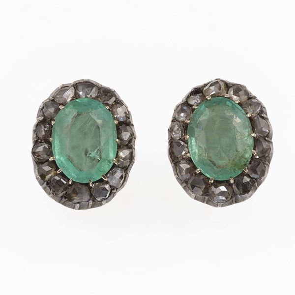 Pair of emerald, diamond, gold and silver earrings