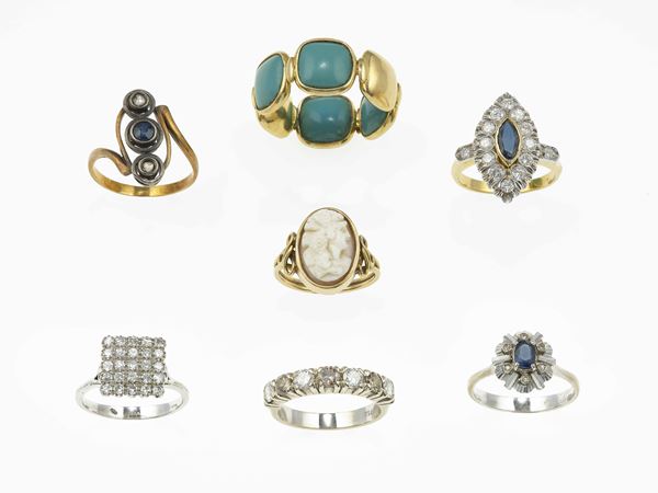 Seven gem-set rings