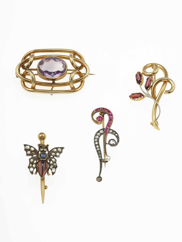 Group of four gold brooches