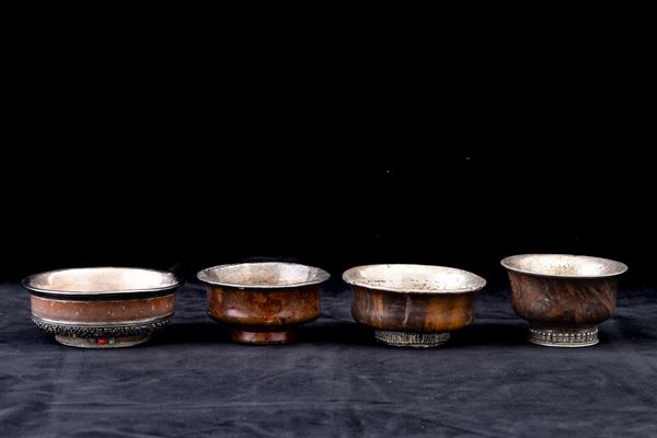 Quattro coppe in legno, argento e innesti di pietre dure, Tibet, XIX secolo