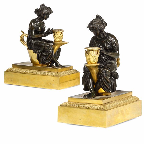 Coppia di candelieri. Bronzo fuso, dorato e patinato. Francia XIX secolo