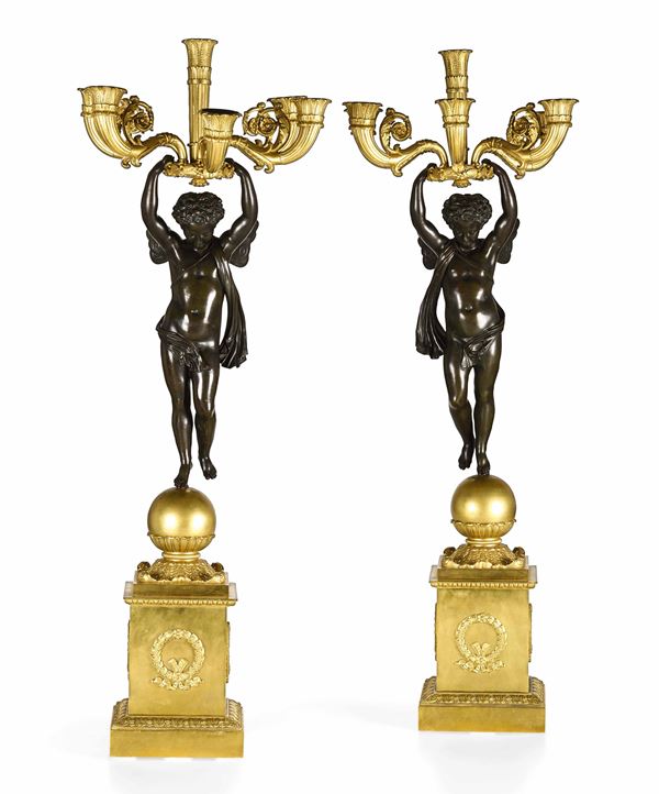 Coppia di grandi candelabri. Bronzo fuso, cesellato, patinato e dorato. Francia XIX secolo