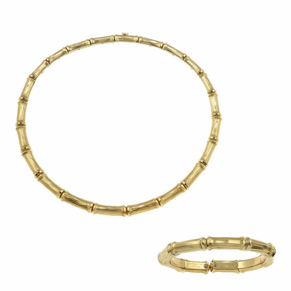 Gold "Bamboo" demi-parure. Signed and numbered Cartier 651759 and 642846