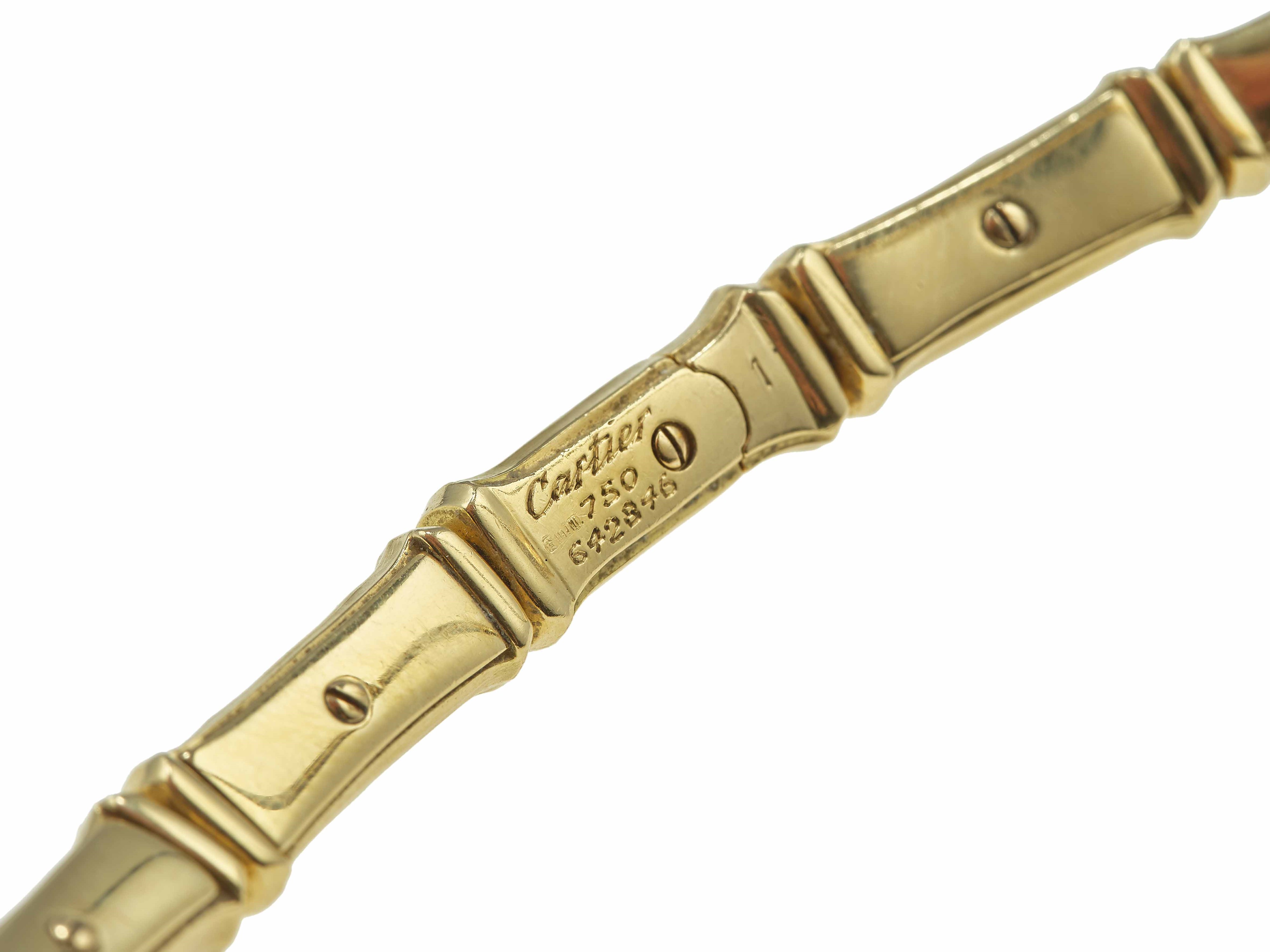 Cartier, Demi-parure “Bamboo” in oro 750/1000 composta da girocollo e bracciale