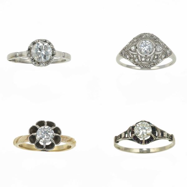 Four diamonds rings. Gold, low karat gold and platinum mounts