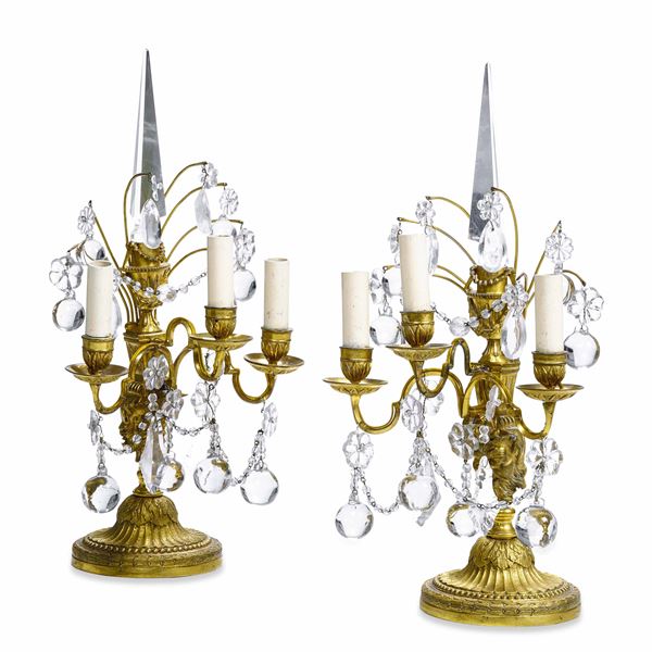 Coppia di girandoles in bronzo dorato e cristalli. XIX-XX secolo