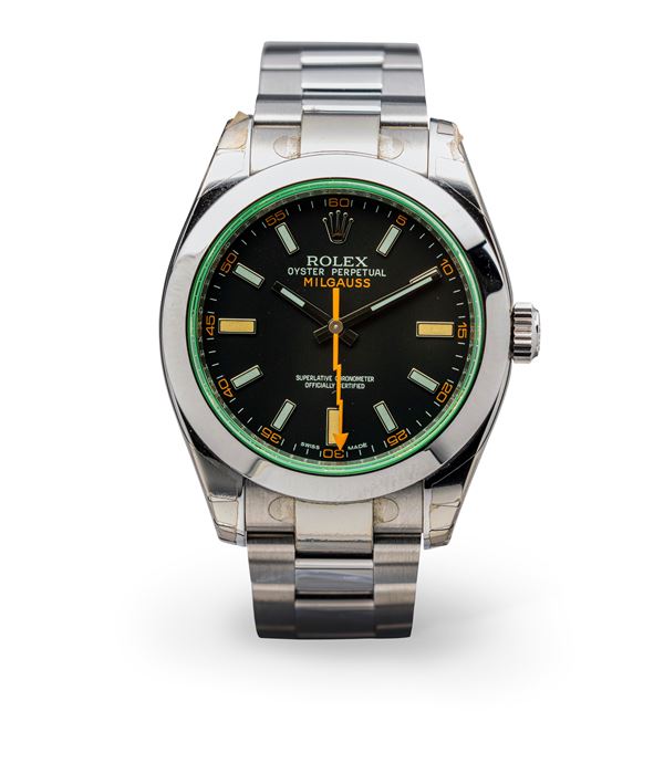 Rolex - Antimagnetic and elegant Milgauss ref 116400GV watch in steel, black dial and green glass, "NOS" with film accompanied by box and warranty