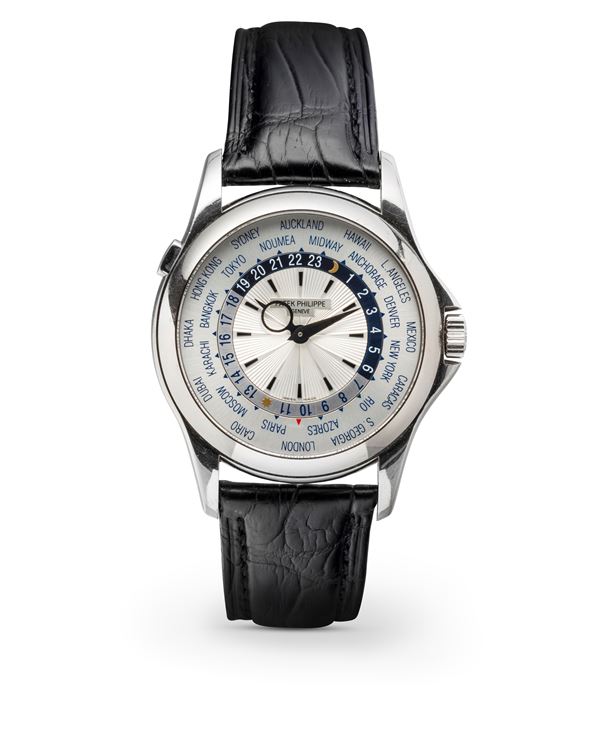 Patek Philippe - Elegant Worldtime ref 5130G in 18k white gold, revolving disc with 24 time zones operated by button at 10 o'clock and Extract from the Archives