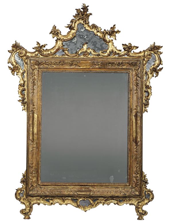 Specchiera in legno intagliato e dorato. Genova XVIII secolo
