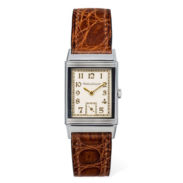 Elegant and rare 1930s stainless steel Reverso, white dial with gold Decò numerals and Chemin de Fer  [..]
