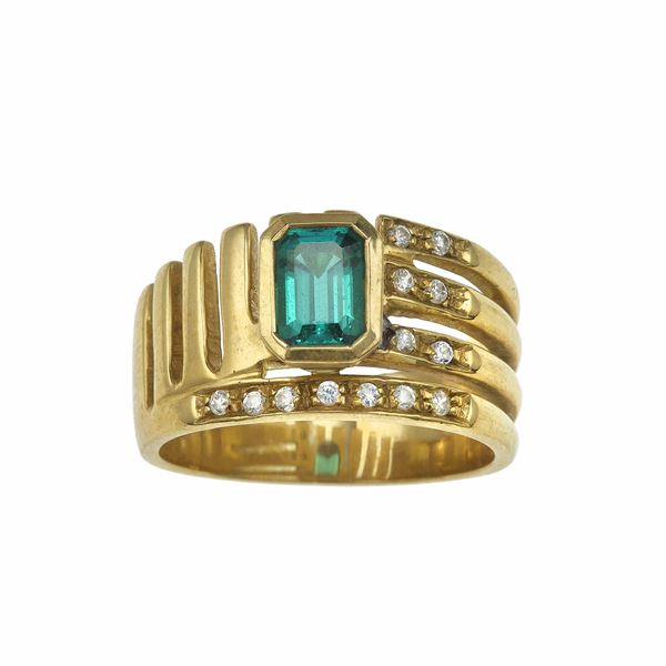 Anello a fascia con smeraldo e piccoli diamanti