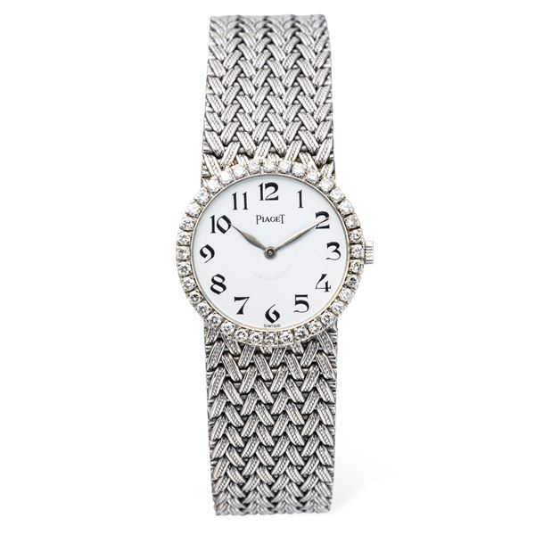 Raffinato orologio in oro bianco 18k con bracciale a maglia intrecciata integrato, ghiera in diamanti,  [..]