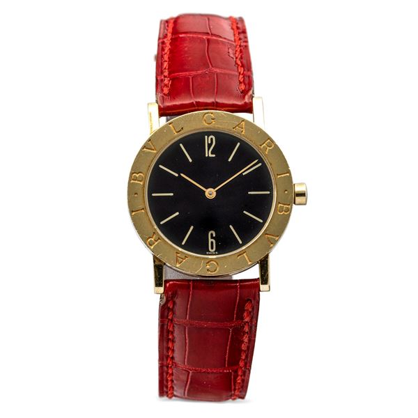 Bulgari - Fine and elegant, Bulgari, Lady wristwatch in yellow gold, black dial and quartz movement