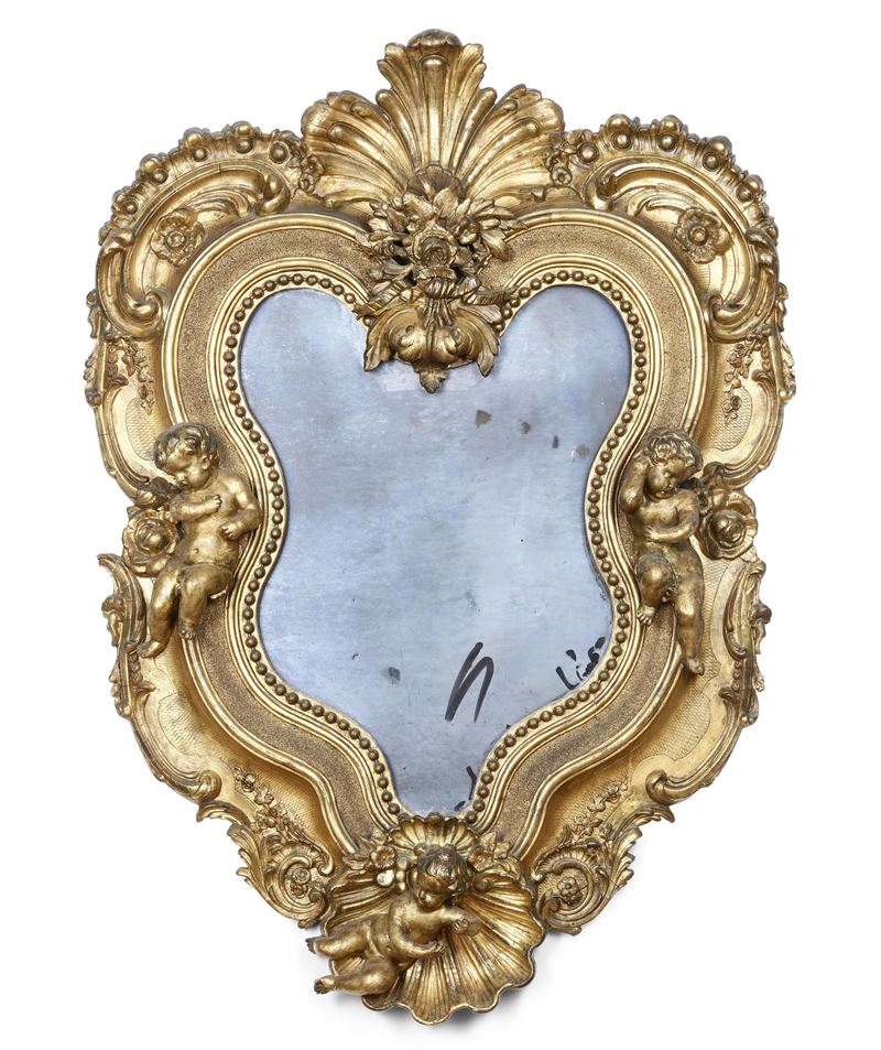 Specchiera sagomata in legno intagliato e dorato.  - Auction Italian Mansions - Cambi Casa d'Aste