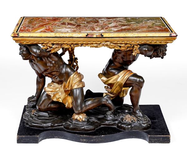 Importante tavolo da parata in legno intagliato, dorato ed ebanizzato. Arte barocca italiana, seconda metà XVII secolo