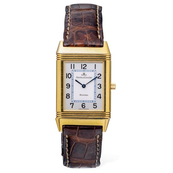 Classic and iconic Reverso Classique in 18k yellow gold Silver dial bitonal with Arabic numerals, leather  [..]
