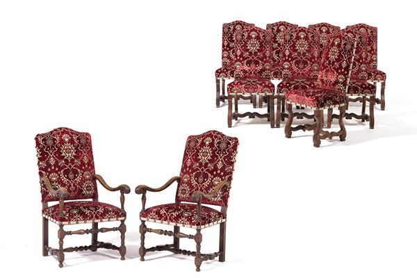 Otto sedie e due poltrone rivestite in tessuto rosso damascato