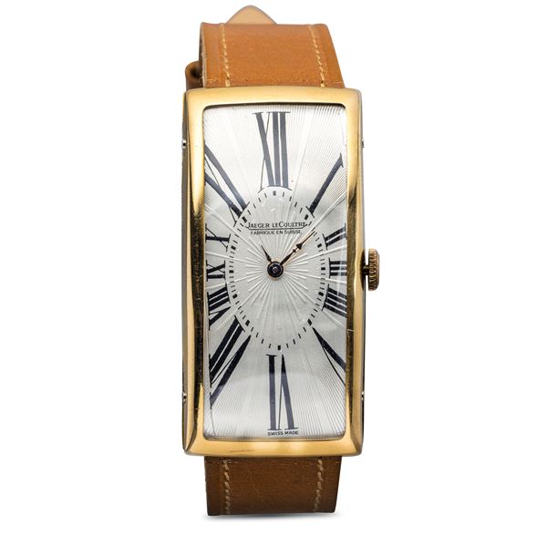 Jaeger-LeCoultre - Charming 18k yellow gold Allongè Tank, Silver dial with embossed workmanship and Roman numbers exploded