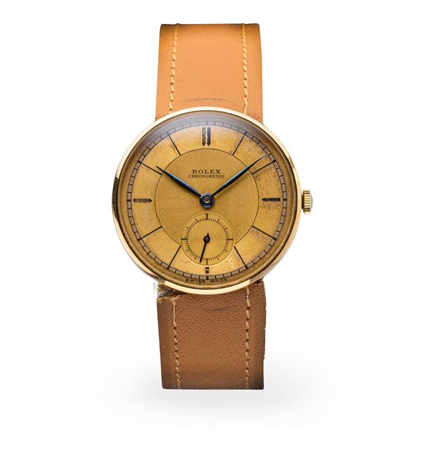 Rolex - Attraente orologio da polso ref 3129 con quadrante a settori bitonale, cassa a disco volante in oro giallo 18k