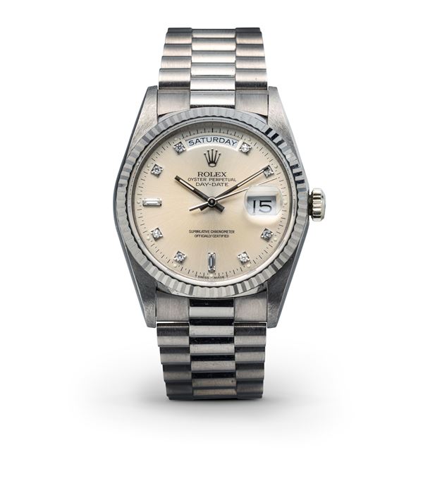 Rolex - Fine and elegant Day-Date ref 18239, 18k white gold, Silver dial with diamond hour markers, President bracelet with invisible clasp, accompanied by original warranty