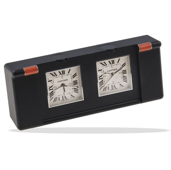 Double coral and PVD steel alarm clock. Signed Cartier. Fitted case