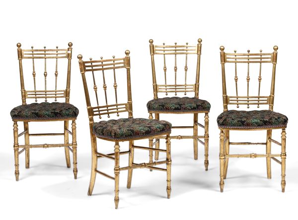 Quattro sedie in legno dorato