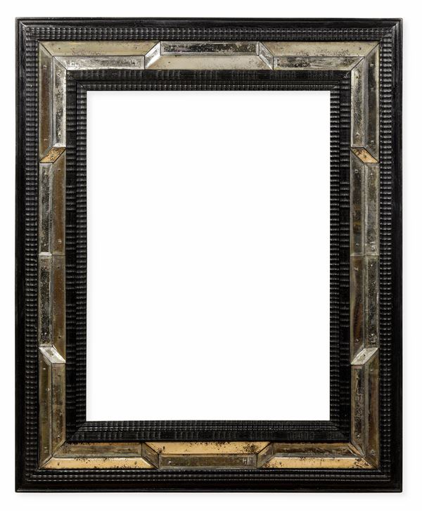 Specchiera guillochè in legno intagliato ed ebanizzato e vetro, Italia o Francia XIX secolo