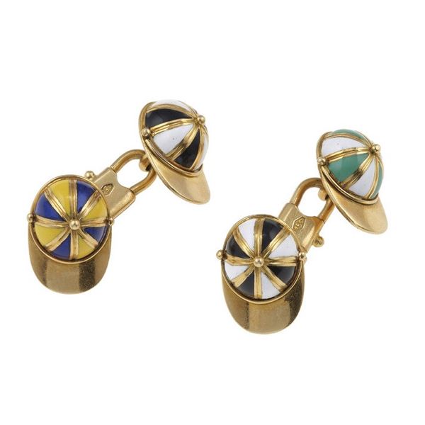 A pair of enamel and gold cufflinks