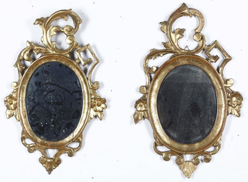 Coppia di specchiere ovali in legno intagliato e dorato. XIX secolo  - Asta Antiquariato  - Cambi Casa d'Aste