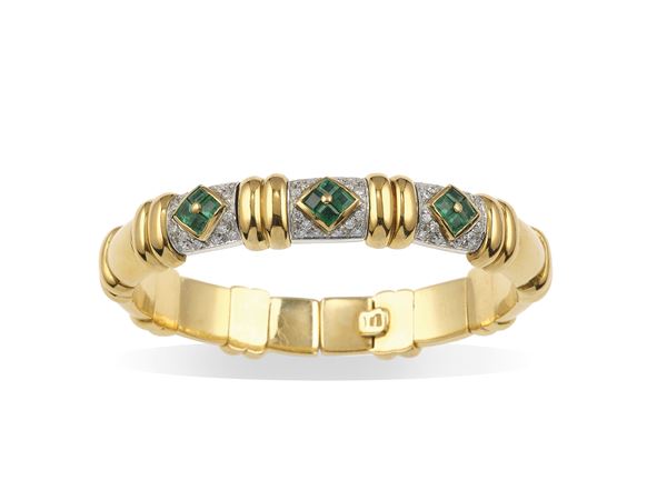 Gold and emerald bangle