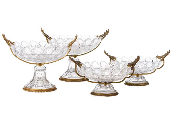 Quattro alzatine in cristallo molato con montatura in bronzo dorato. Francia XIX-XX secolo