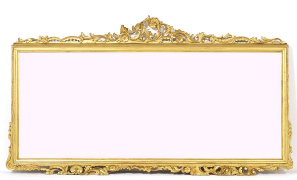 Specchiera in legno intagliato e dorato. XX secolo