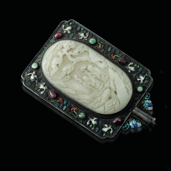 A mirror with a jade plaque and a silver mounting, China