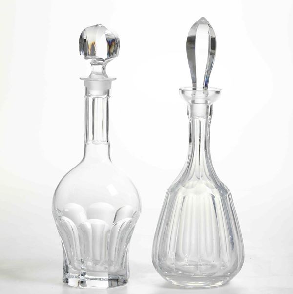 Due bottiglie in cristallo molato. XX secolo