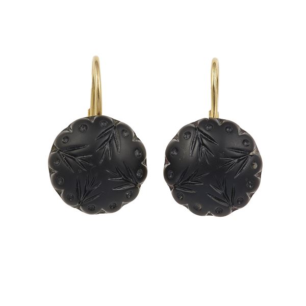 Pair of carved jet and gold earrings. Signed Merù