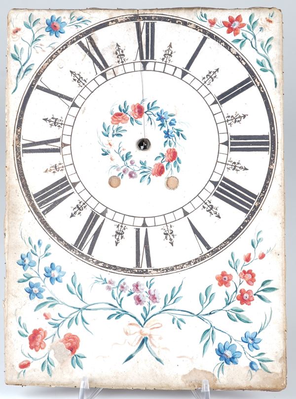 Antico quadrante in pergamena dipinta con motivi floreali