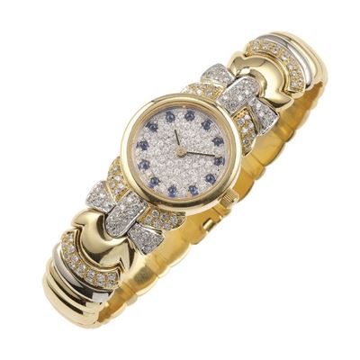 Orologio e bracciale semirigido, pavé di diamanti in oro giallo 750/1000