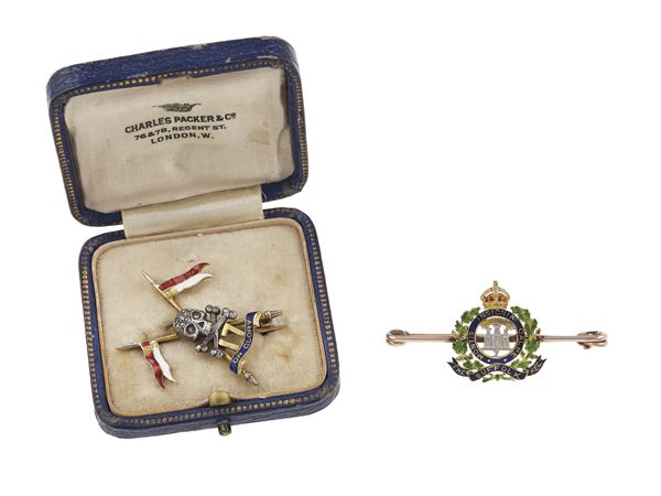 Two enamel, silver and gold regimental brooches