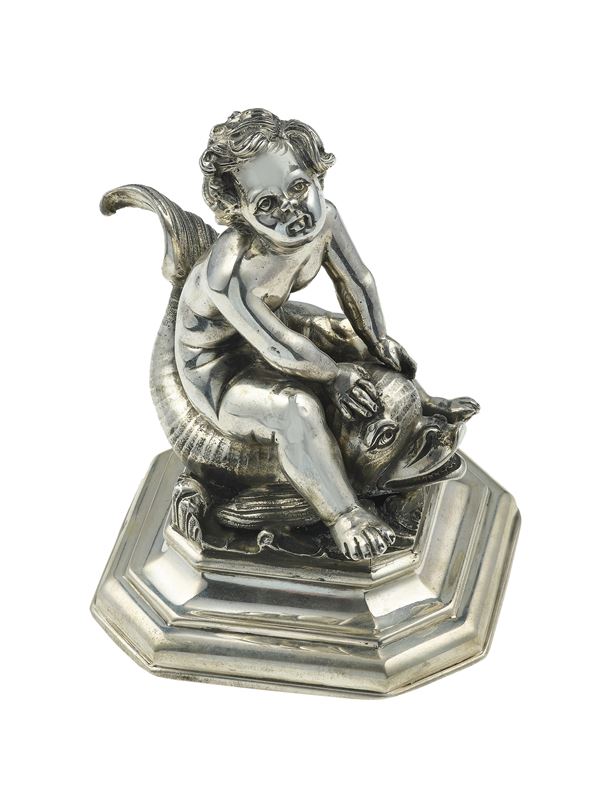 Silver putto with dolphin. Signed M. Buccellati